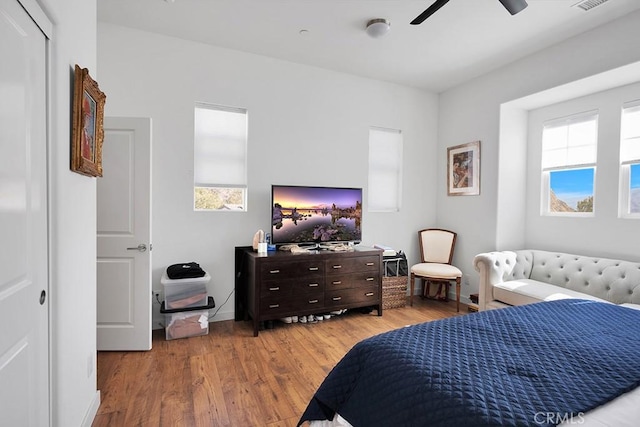 bedroom with light wood-type flooring and ceiling fan