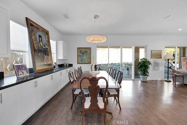 dining area featuring dark hardwood / wood-style floors and plenty of natural light