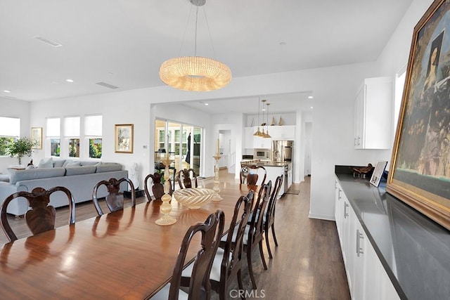 dining space featuring dark hardwood / wood-style flooring