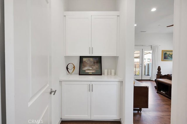 details with french doors and wood-type flooring