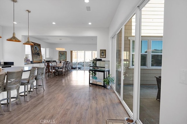 dining area with hardwood / wood-style flooring