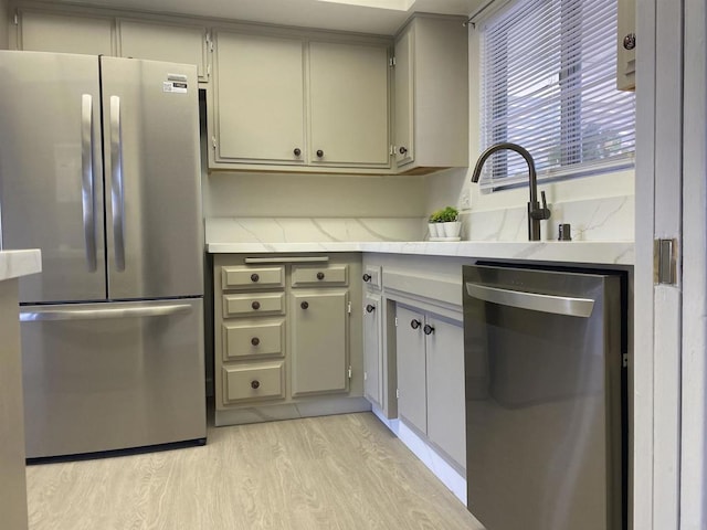 kitchen featuring light wood-type flooring and appliances with stainless steel finishes