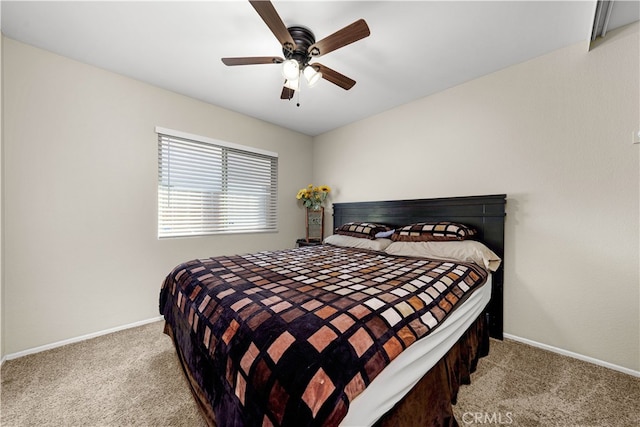 bedroom featuring light carpet and ceiling fan