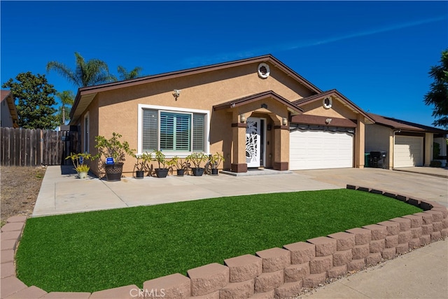 view of front of home with a front lawn and a garage