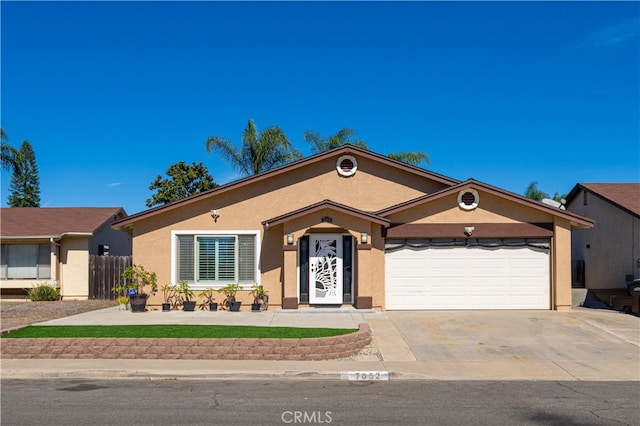 ranch-style home featuring a garage