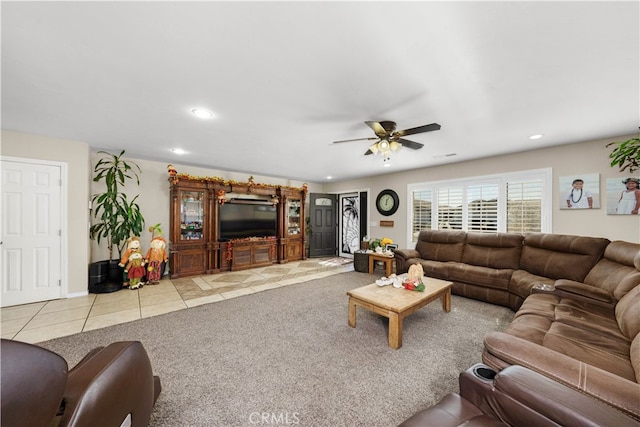 living room featuring ceiling fan and light tile patterned floors