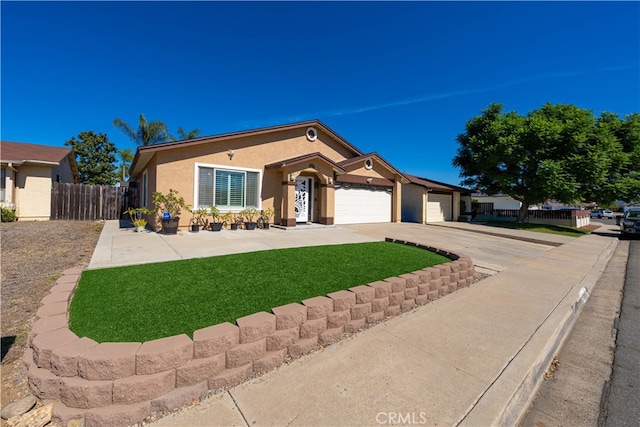 ranch-style home with a front lawn and a garage