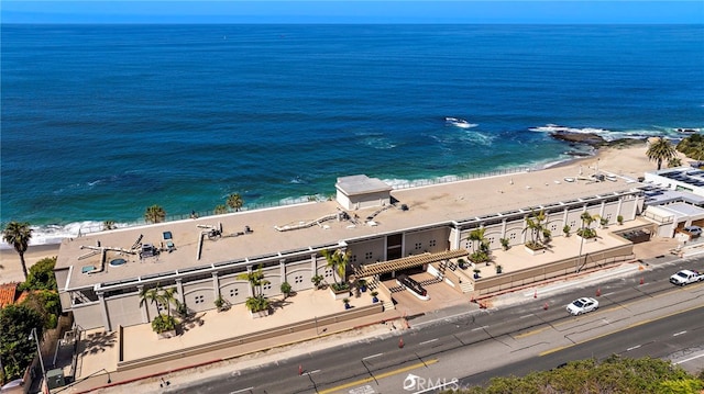 exterior space with a beach view and a water view