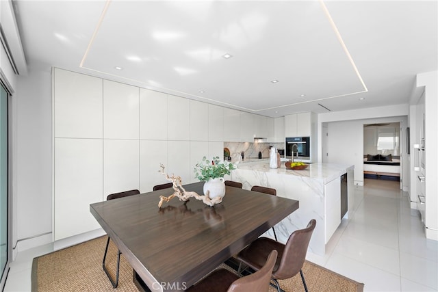 dining space featuring light tile patterned floors