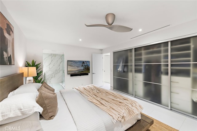 bedroom featuring ceiling fan and light tile patterned flooring