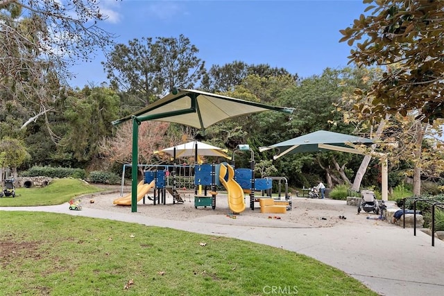 view of jungle gym featuring a lawn