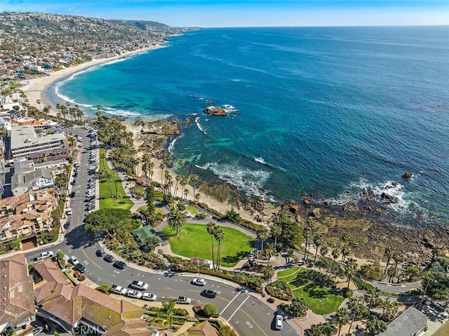 aerial view with a water view and a beach view