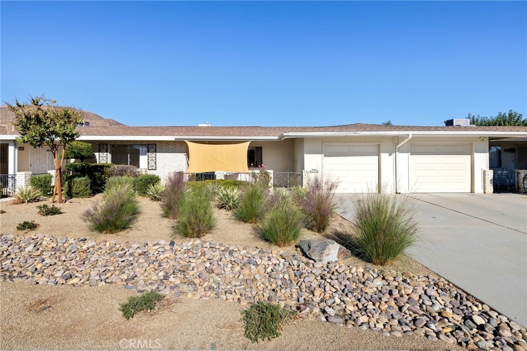 ranch-style home featuring a garage