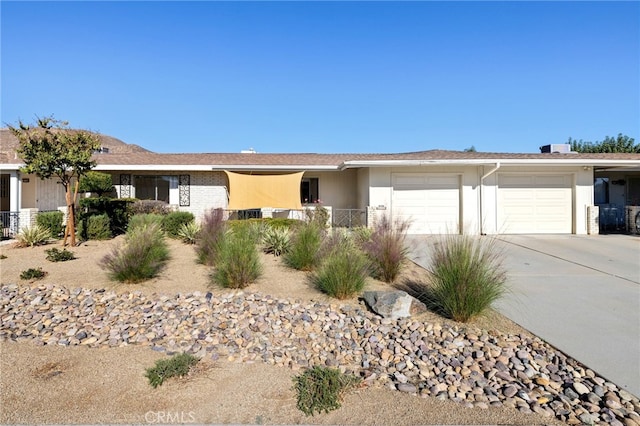 ranch-style home featuring a garage