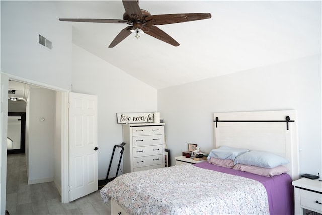 bedroom with high vaulted ceiling, light wood-type flooring, and ceiling fan