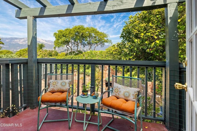 balcony featuring a mountain view