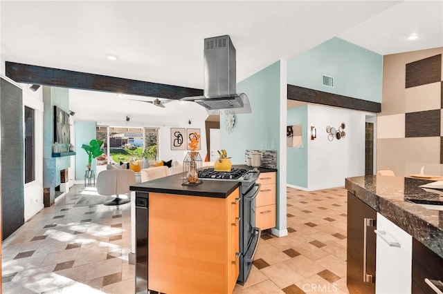 kitchen with island exhaust hood, black gas stove, and beam ceiling