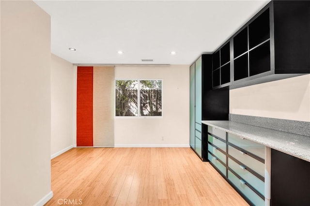 kitchen with hardwood / wood-style flooring