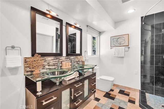 bathroom with walk in shower, tile patterned flooring, toilet, decorative backsplash, and vanity