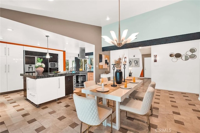 dining space featuring an inviting chandelier and lofted ceiling