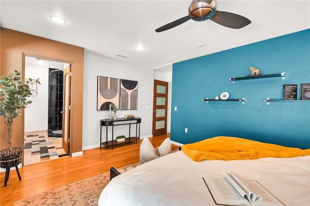 bedroom featuring hardwood / wood-style floors and ceiling fan