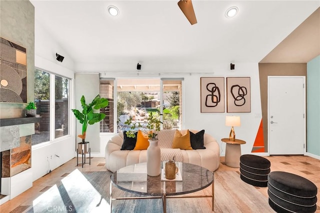 living room featuring light hardwood / wood-style flooring and vaulted ceiling