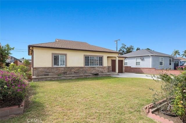 view of front of property with a patio area and a front lawn