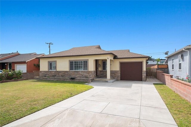 view of front of property with a front lawn and a garage