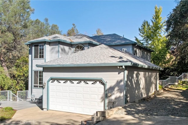 view of side of home featuring a garage