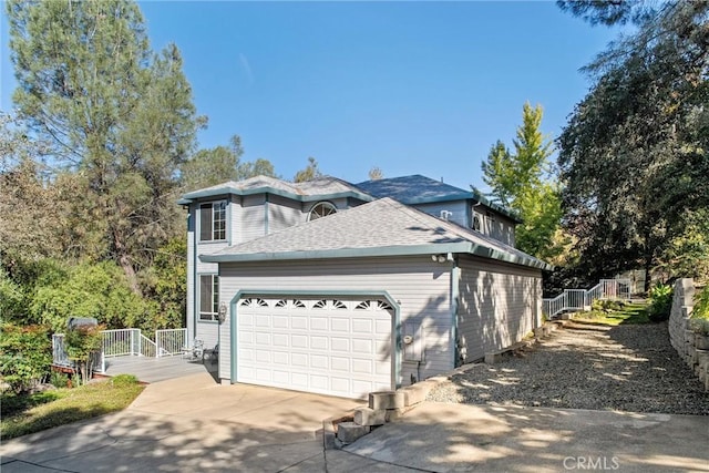 view of property exterior with a garage