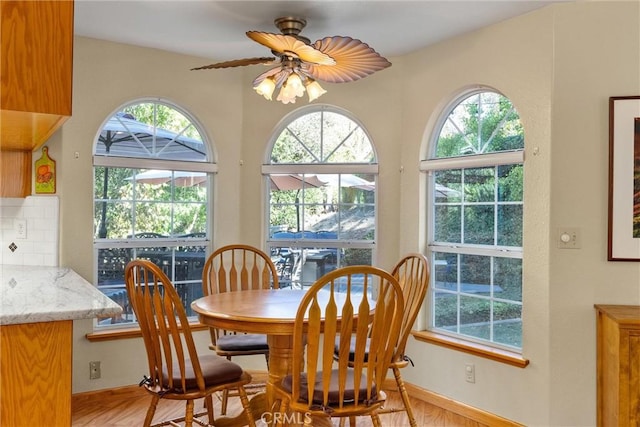 dining space with ceiling fan