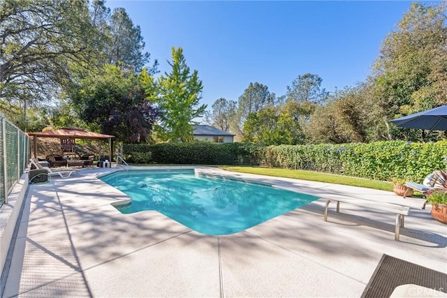 view of swimming pool with a gazebo and a patio