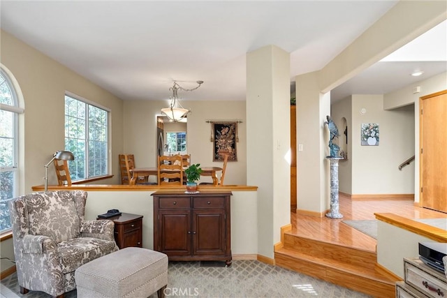 sitting room with light colored carpet