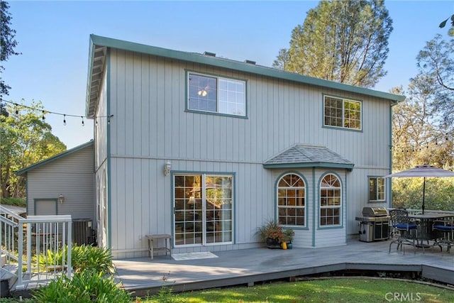 rear view of house with a deck