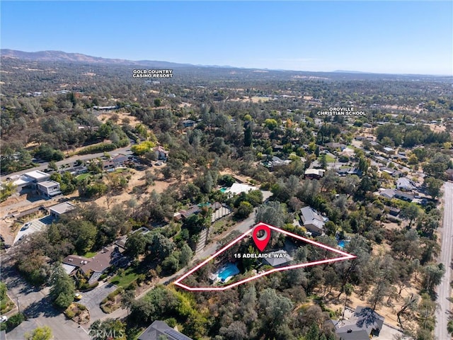 birds eye view of property featuring a mountain view