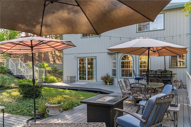 wooden deck with a fire pit