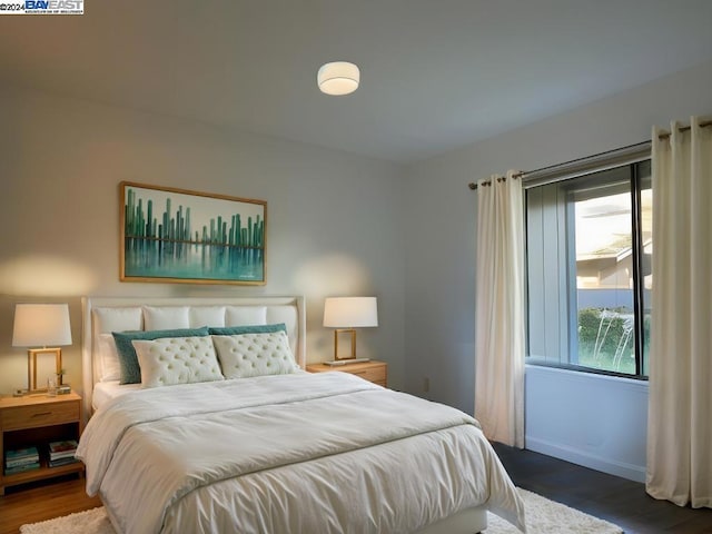 bedroom featuring dark hardwood / wood-style floors