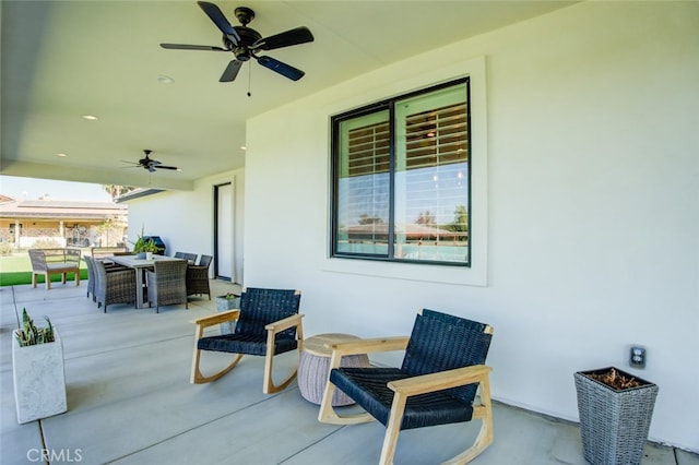 view of patio featuring ceiling fan and an outdoor living space