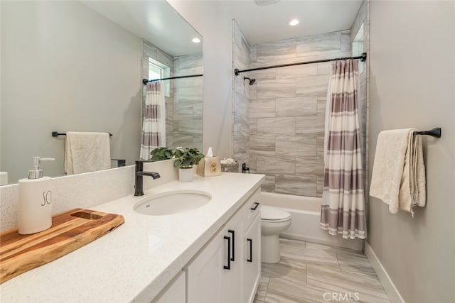full bathroom with vanity, toilet, and shower / tub combo