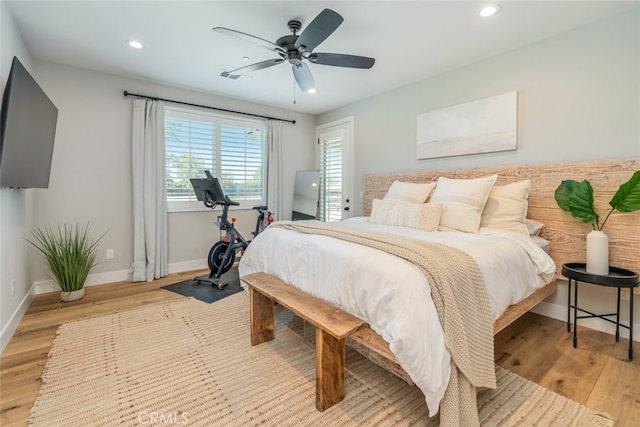bedroom featuring ceiling fan and light hardwood / wood-style flooring