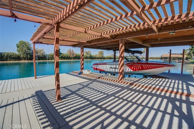 dock area with a water view and a pergola