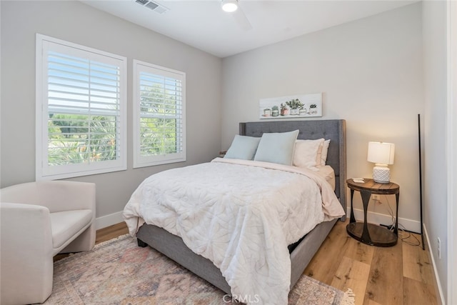 bedroom featuring light hardwood / wood-style floors and ceiling fan
