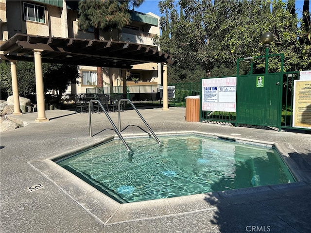 view of swimming pool featuring a pergola