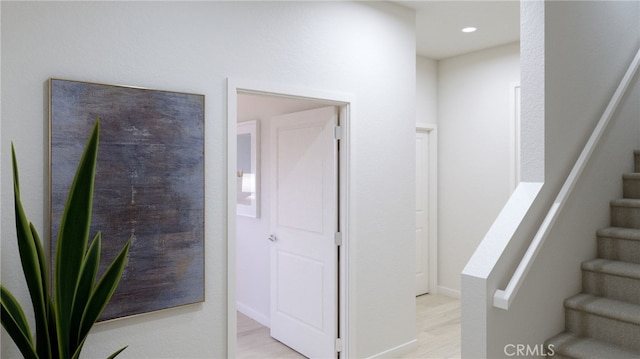 stairway with wood-type flooring