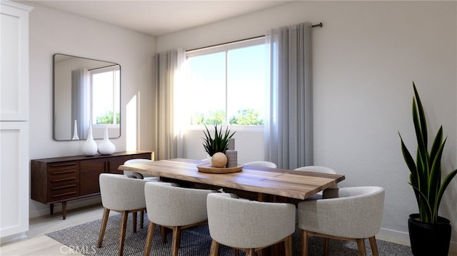 dining area with light hardwood / wood-style floors