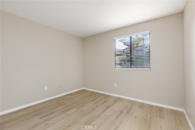 spare room with light hardwood / wood-style floors