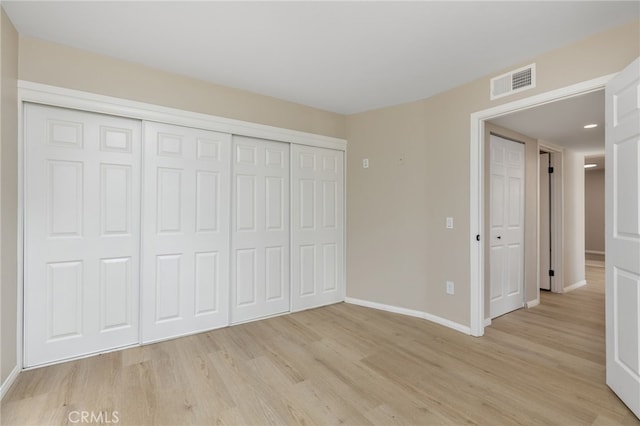 unfurnished bedroom with light hardwood / wood-style floors