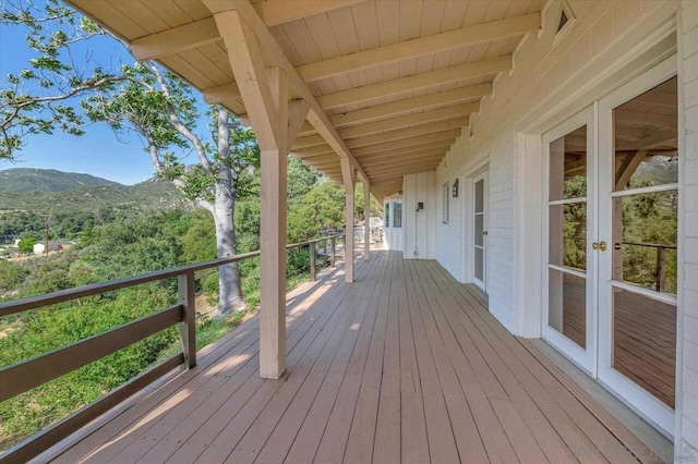 deck with a mountain view and french doors