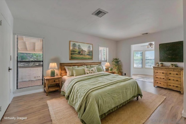 bedroom with light hardwood / wood-style flooring