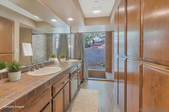 bathroom featuring vanity and hardwood / wood-style floors